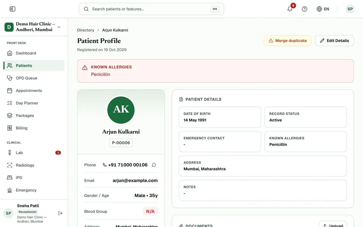 A patient’s record with the Edit Details button above it highlighted.